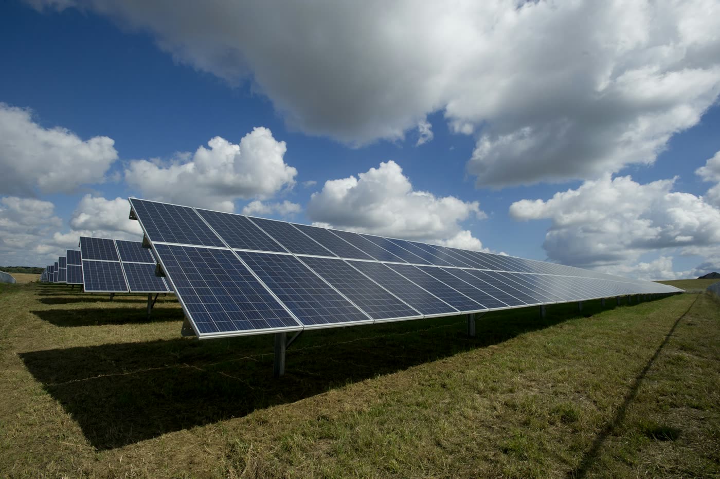 Utility-scale solar array at dusk